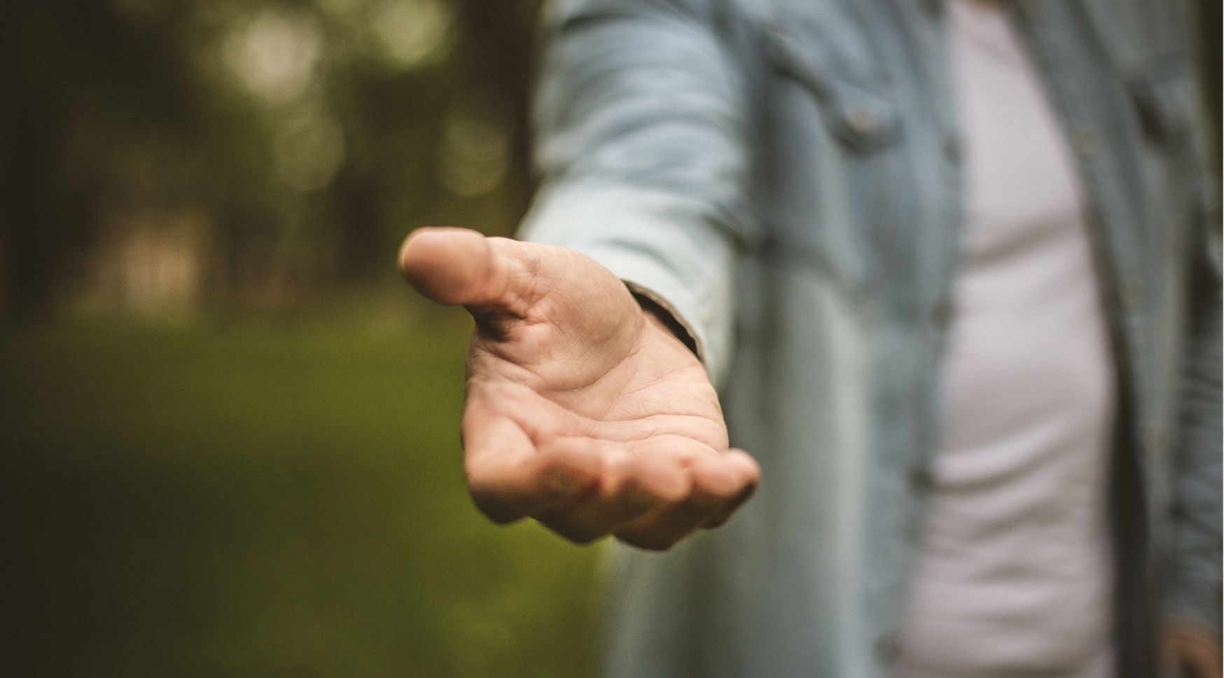 Man holding out his hand